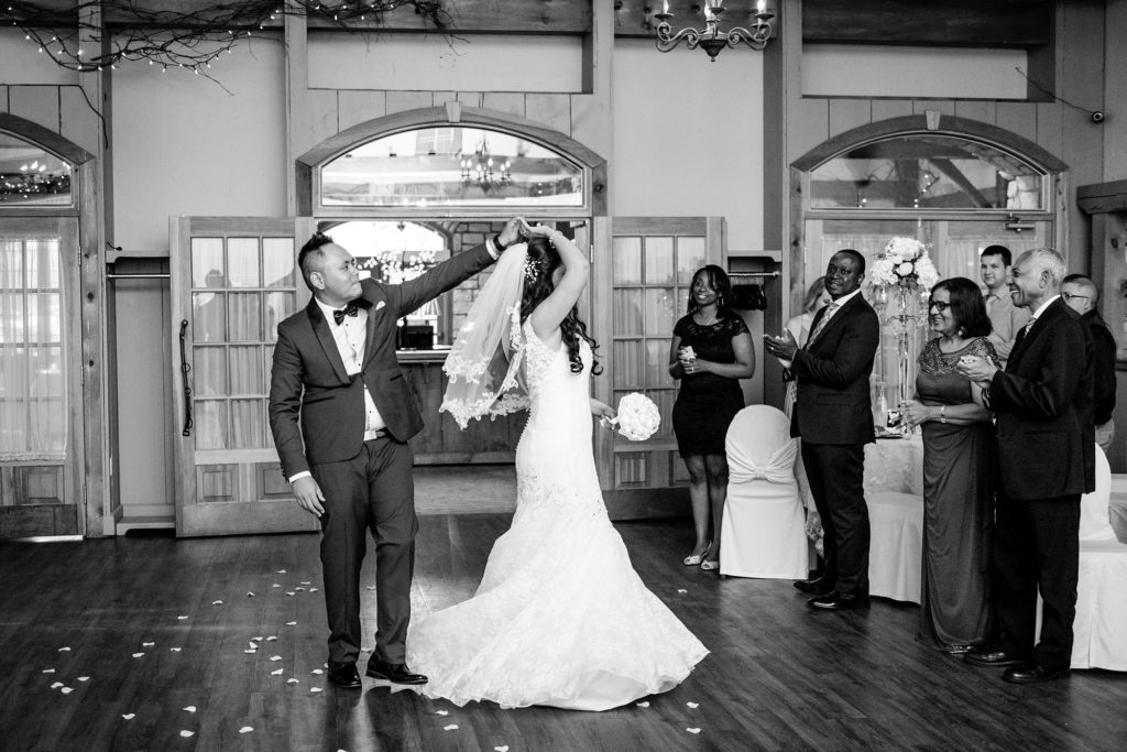 groom twirls bride at their bellamere winery wedding reception