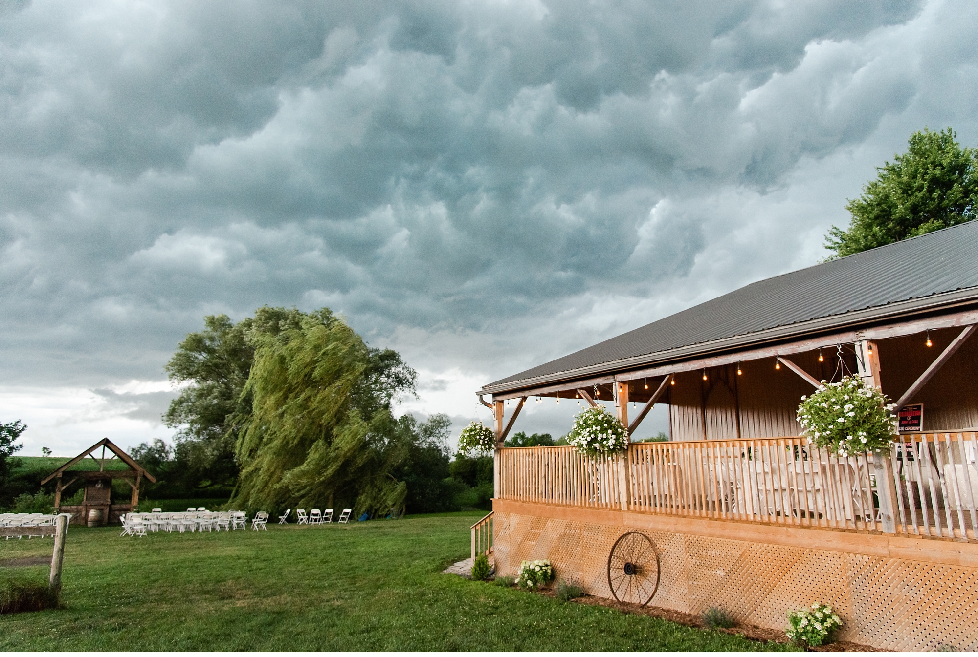storm clouds form overtop of a wedding venue in kelowna british columbia