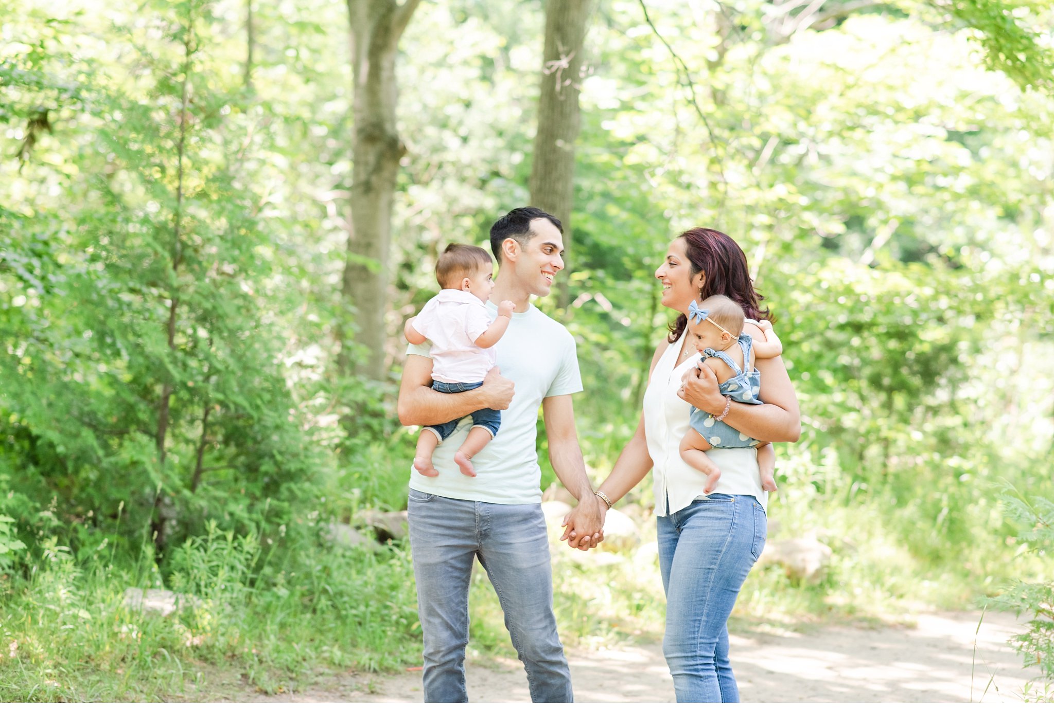 a family walking together for photos in springbank park