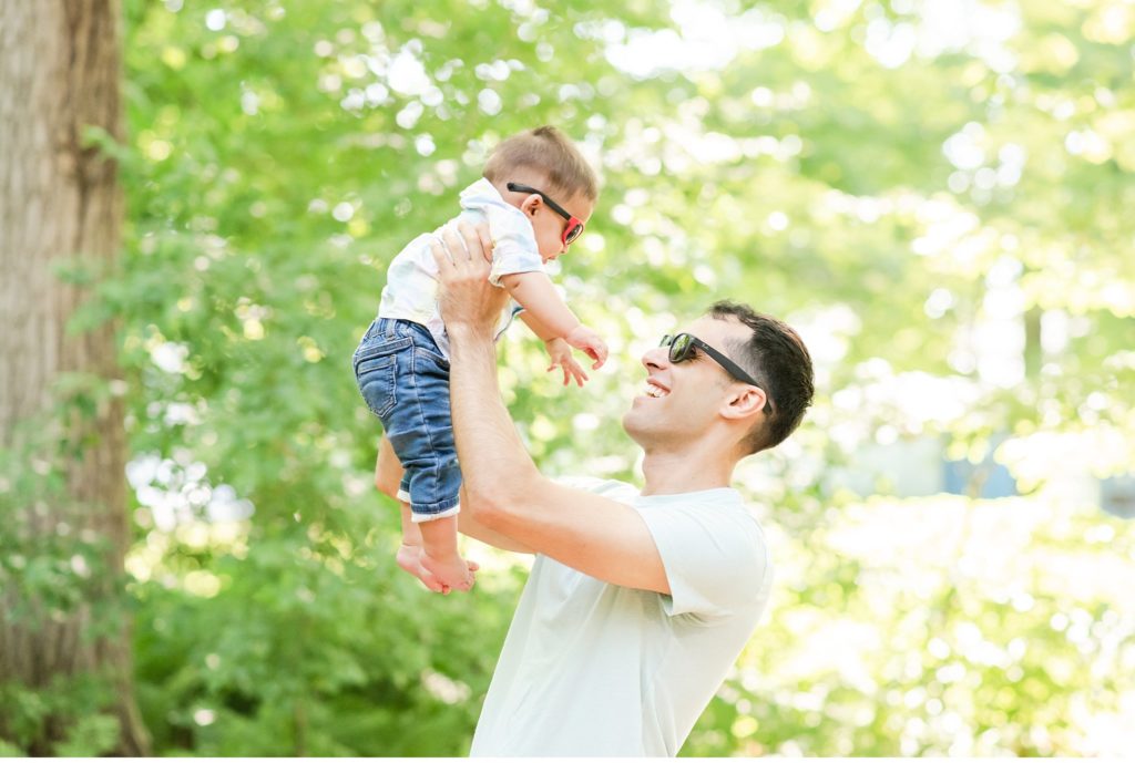 a dad playing with his son during a family portrait session