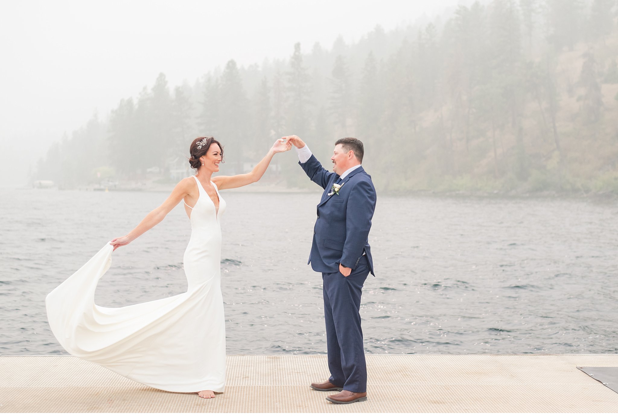 groom twirls bride at lake okanagan