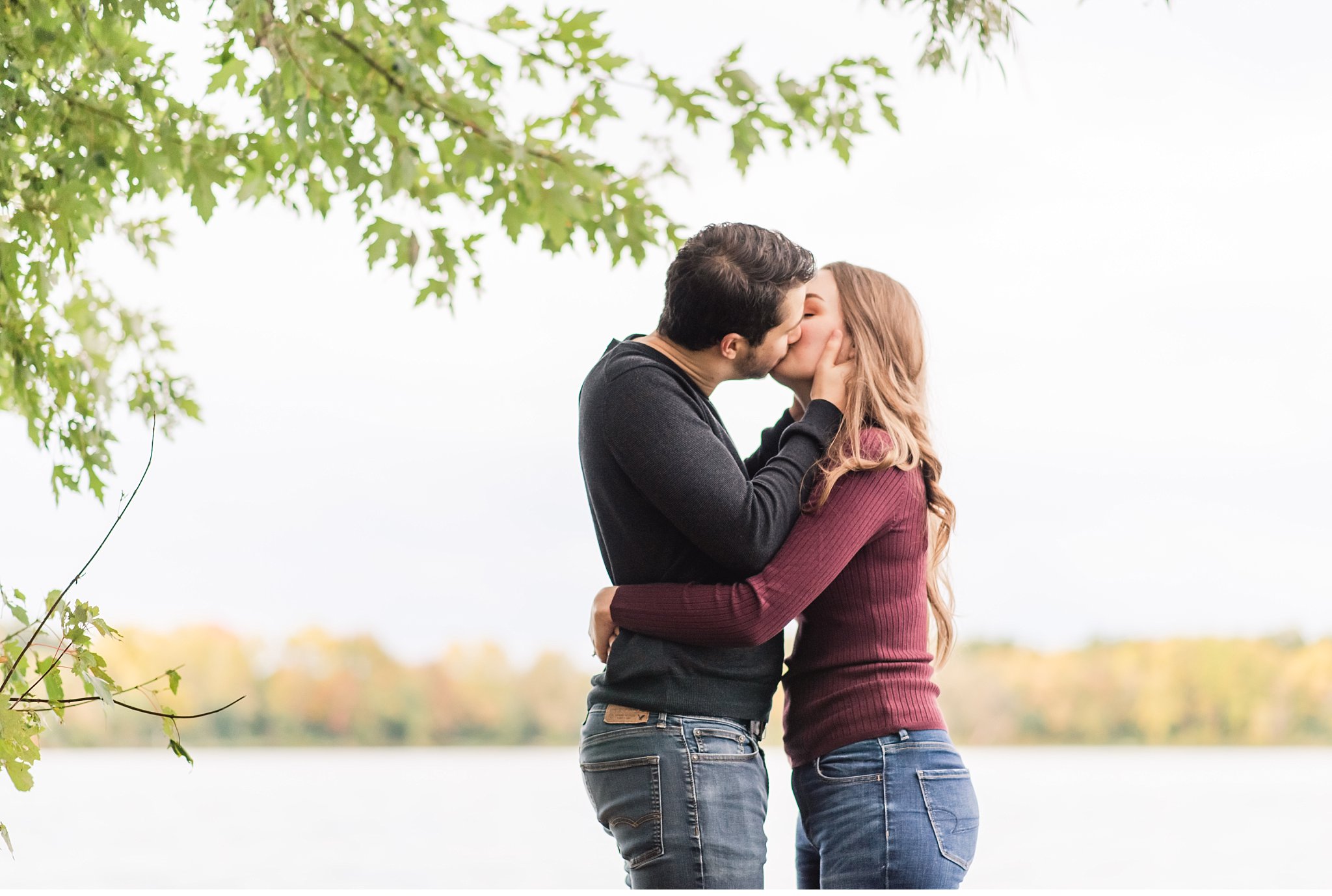 couple kisses during engagement session at fanshawe conservation area
