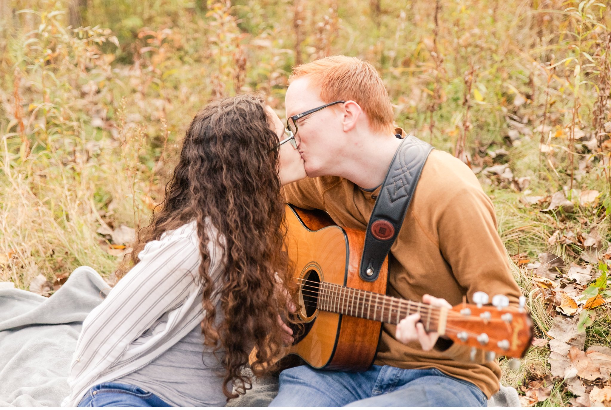 A couple kisses during their engagement session