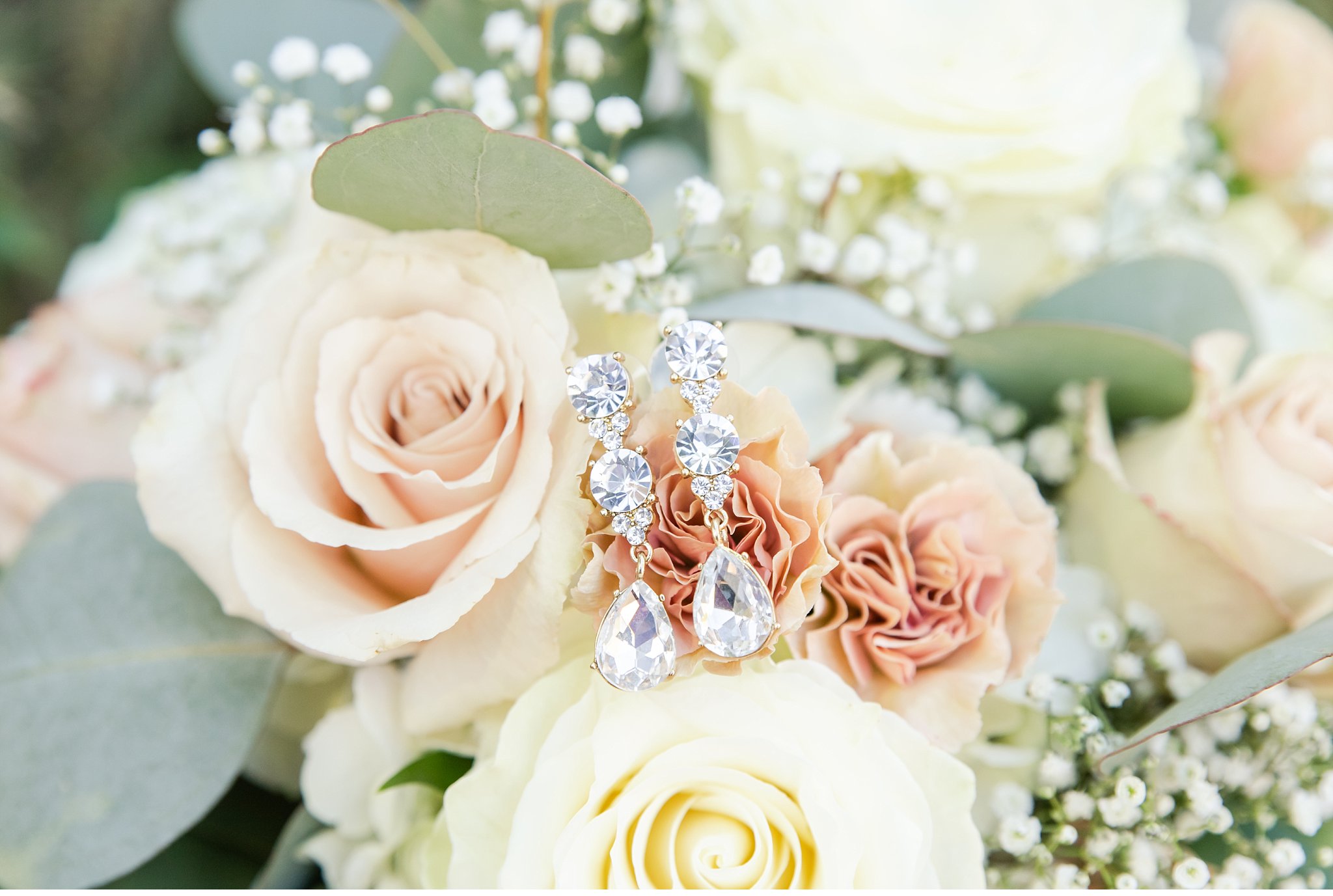 bride's earrings and bouquet