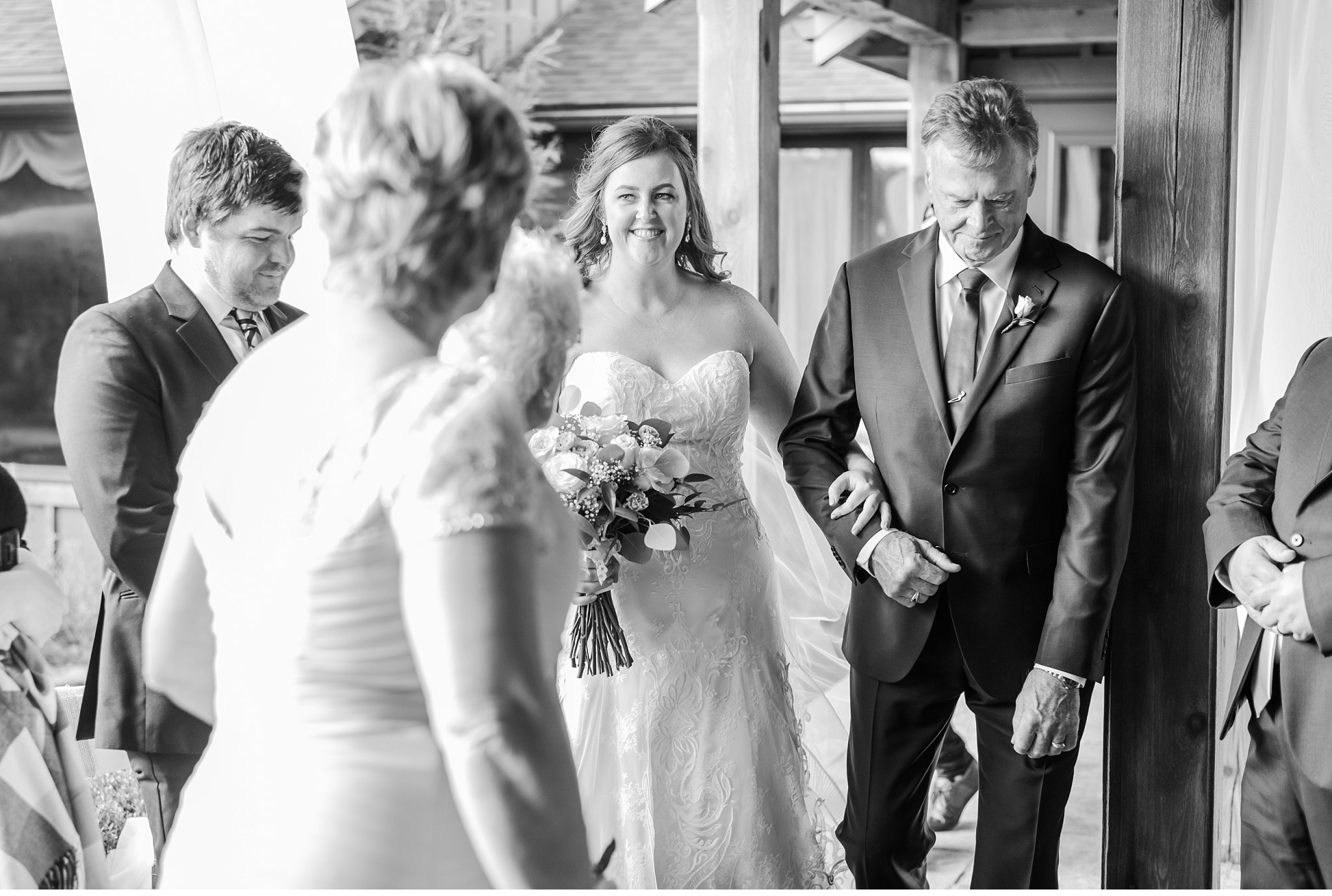 bride walks up the aisle with her dad