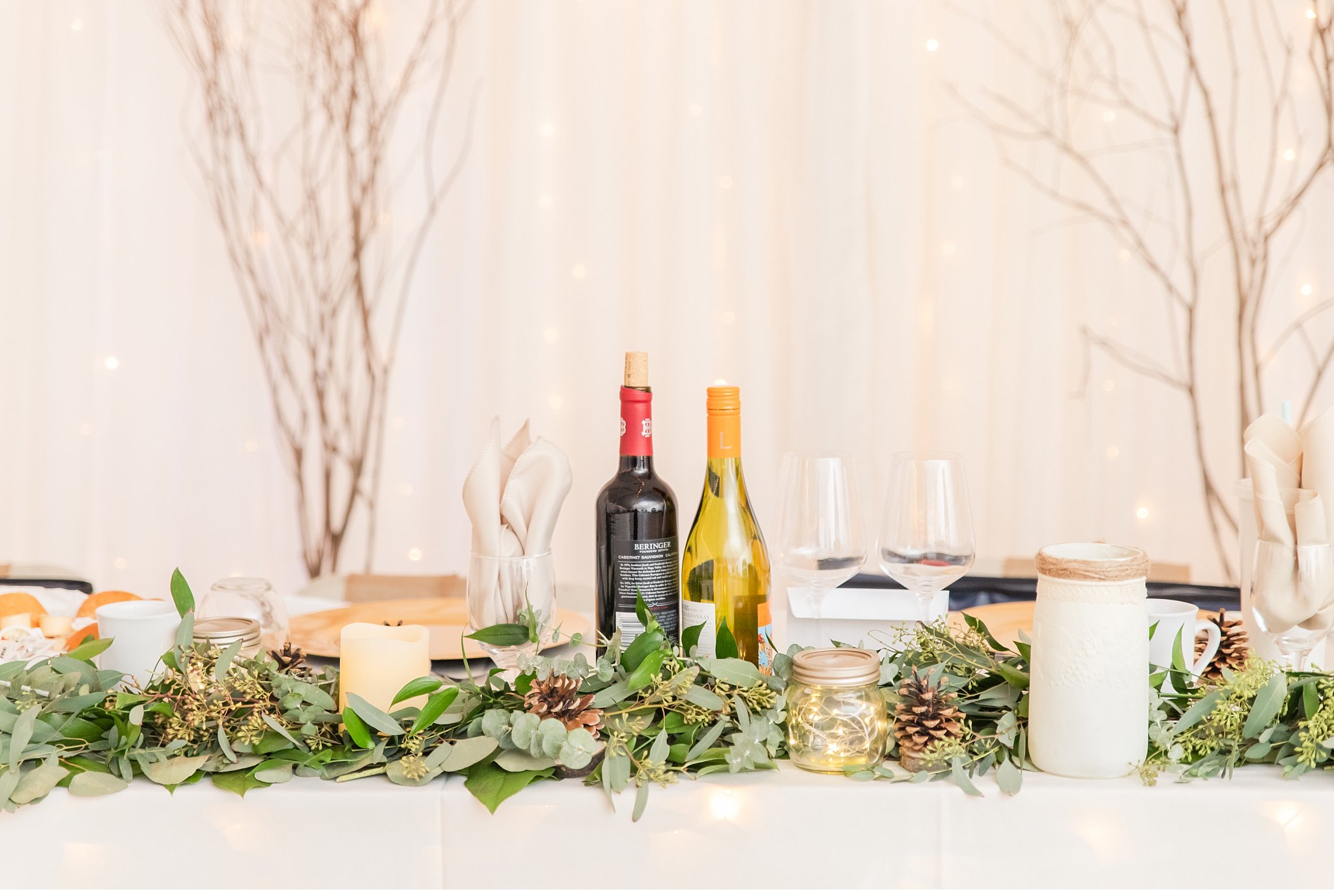 wine bottles and greenery wedding decor