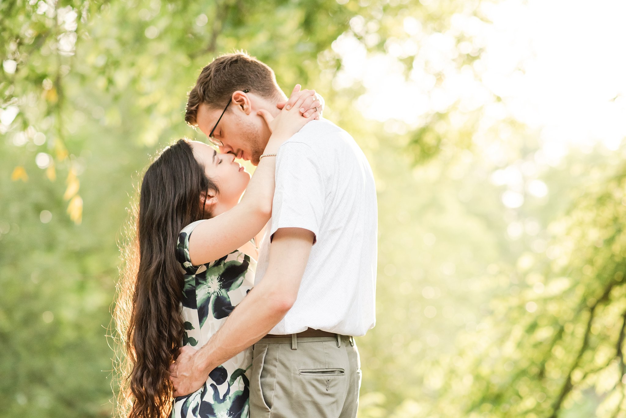 a couple kisses at rock glen conservation area during their engagement session by london ontario wedding photographer life is beautiful photography
