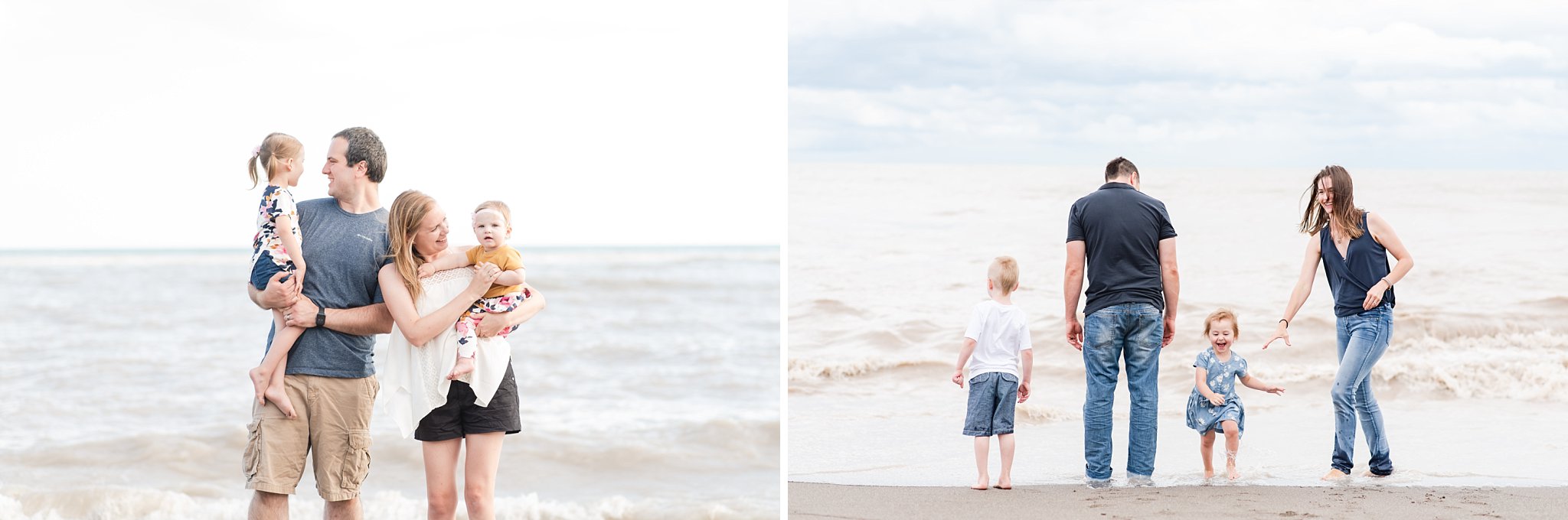 a little girl in a blue dress runs away from waves at the beach and her mother in a blue shirt and blue jeans chases her. the father and little boy stand looking at the water and cloudy sky. family photography london ontario