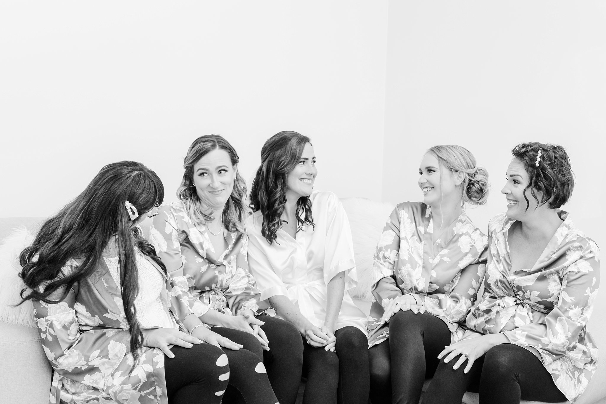 a bridal party laughs together at a caradoc sands wedding