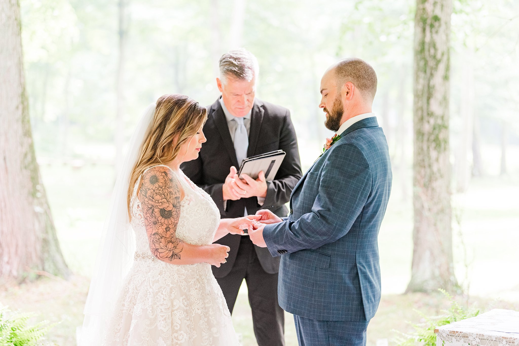 the groom puts a ring on the bride's finger