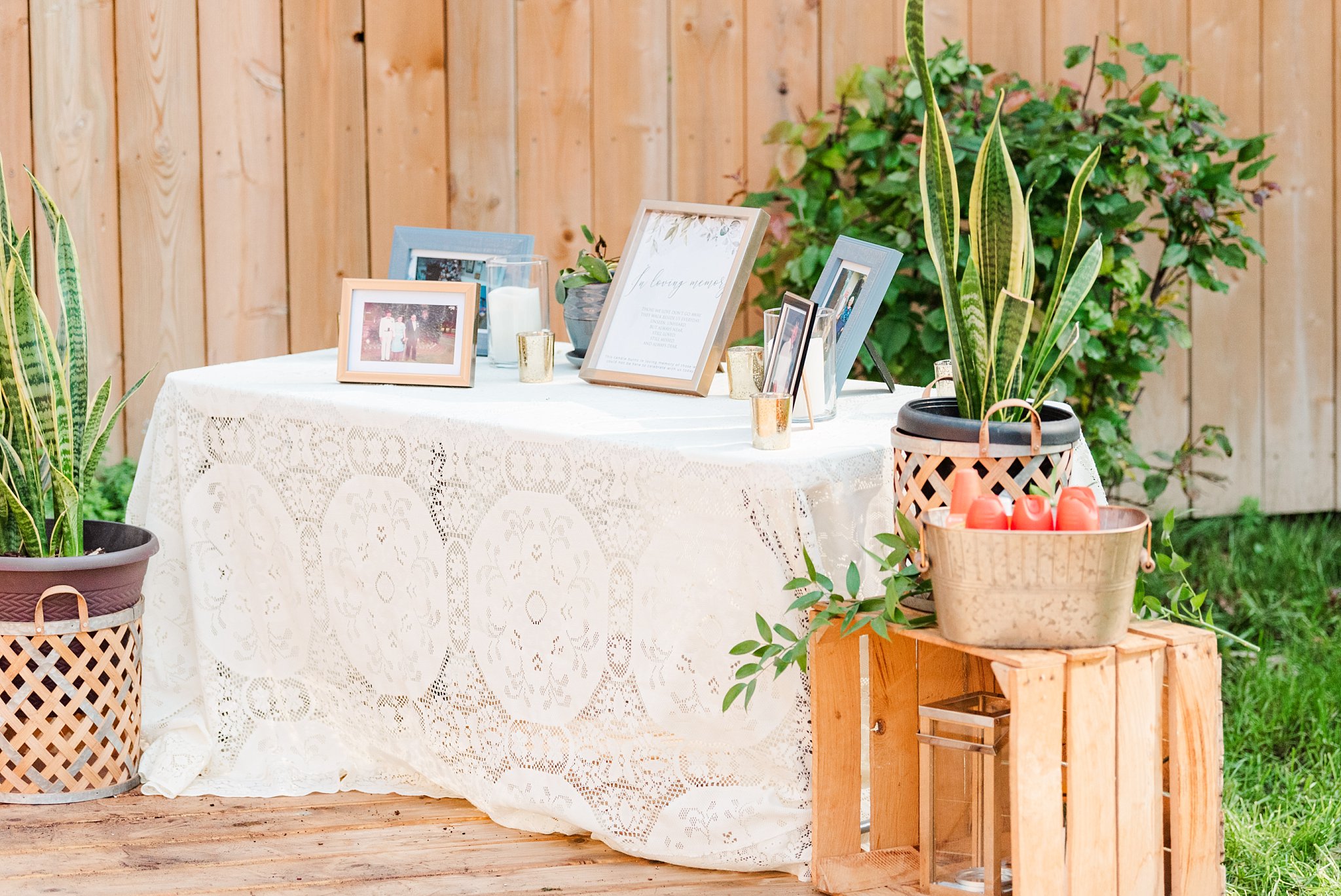 frames on a table draped in white lace