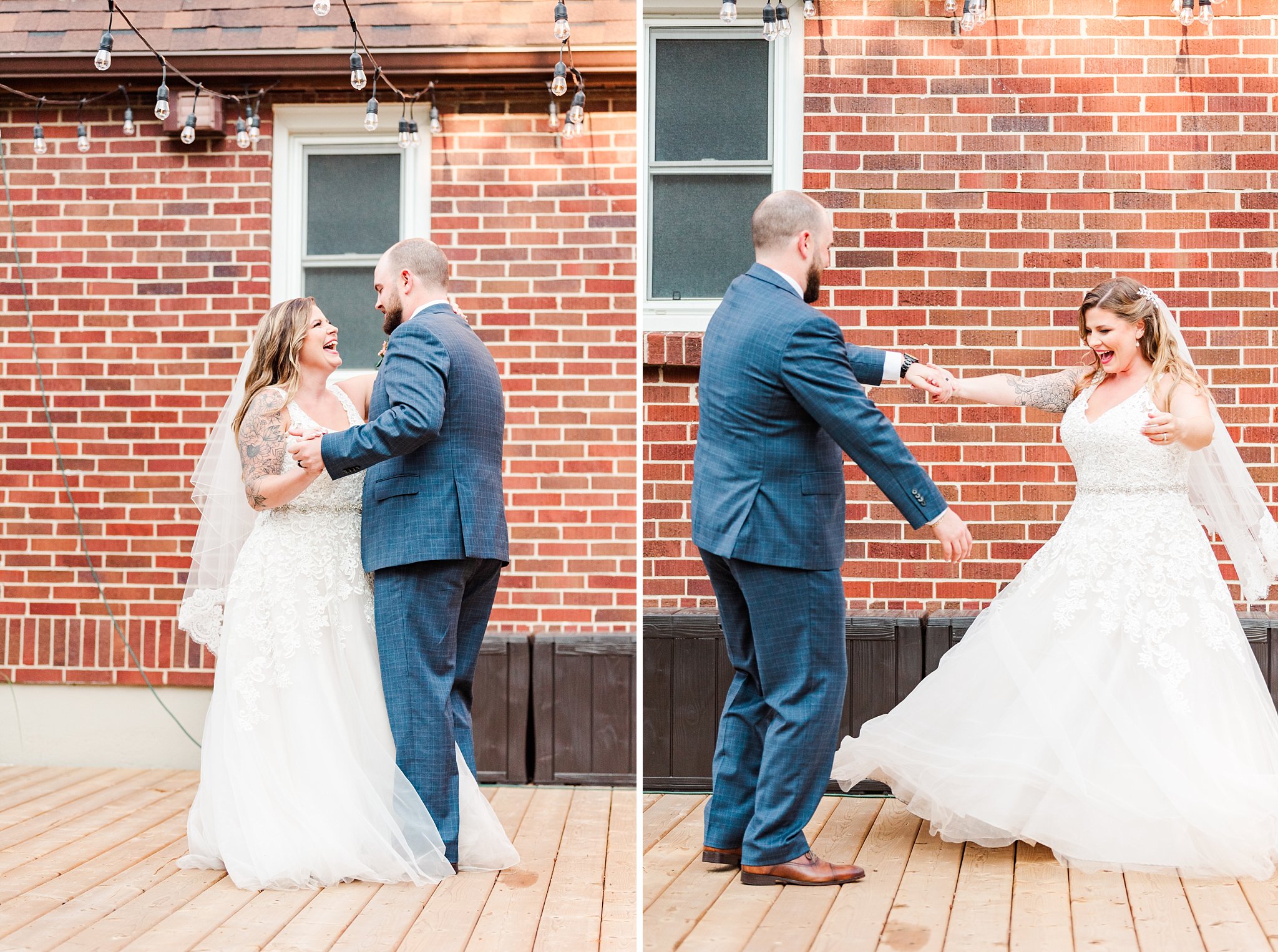 the bride and groom dance in front of a red brick wall