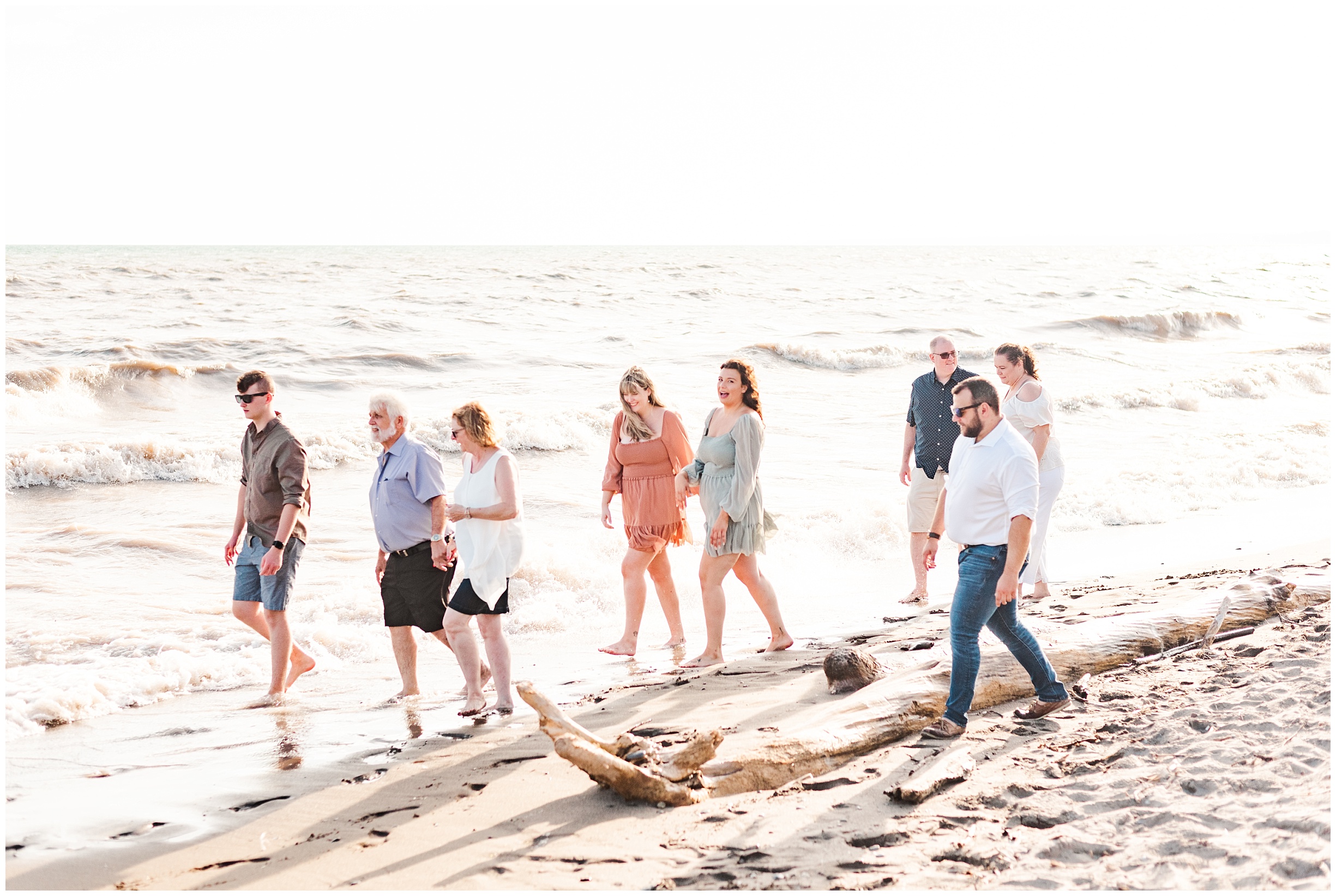 a family walks down the beach together in port stanley; family photographers near me