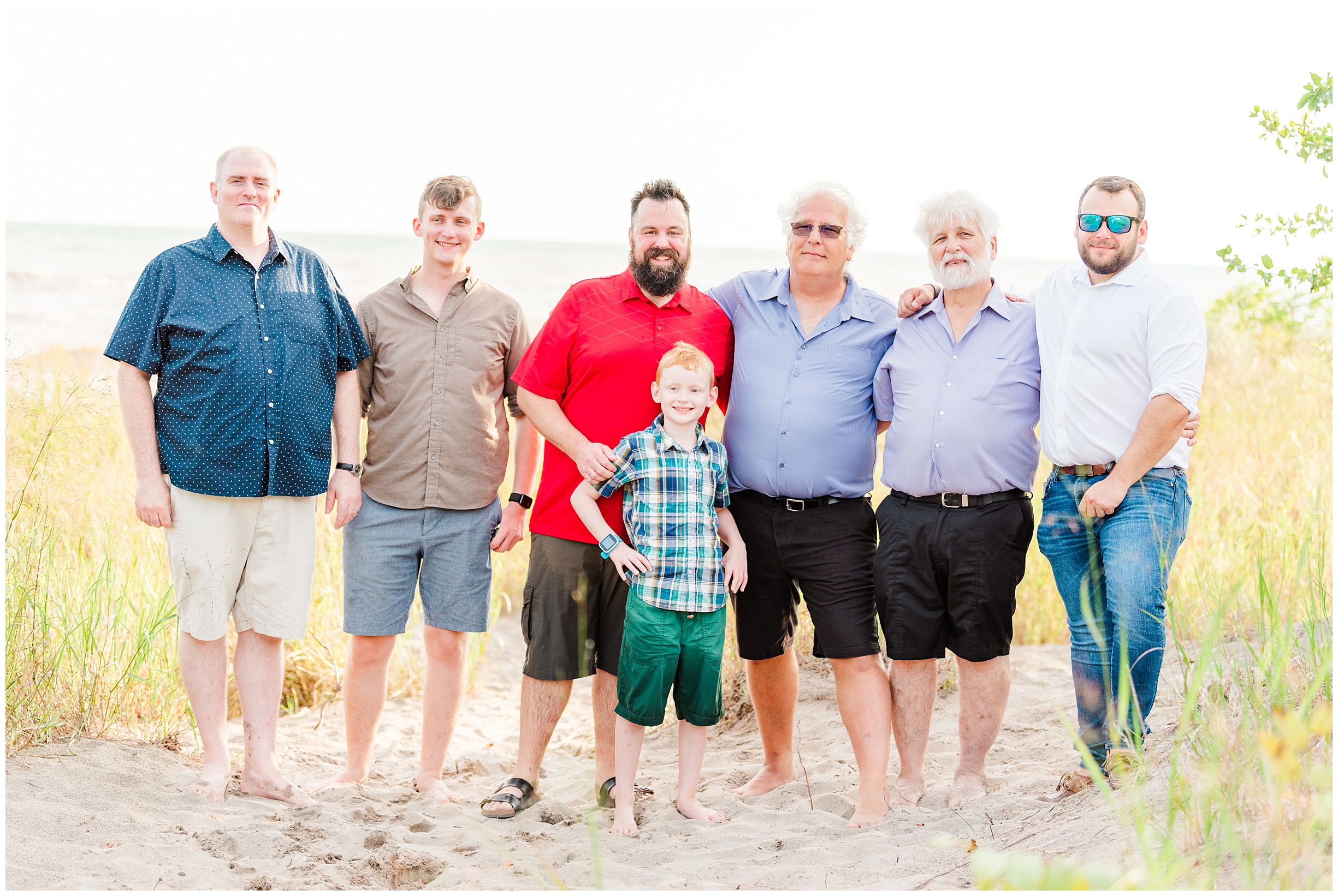 a grandfather poses with his son, sons in law, and grandsons; family photographers near me