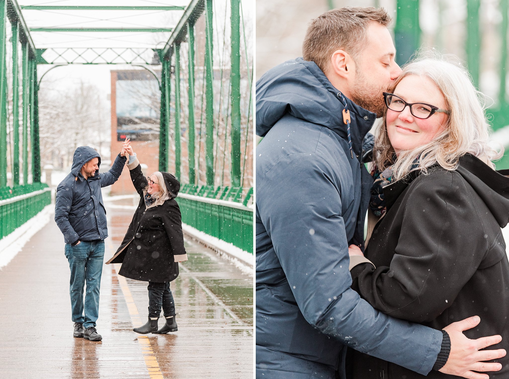 a man twirls a woman around in the snow as they walk across the bridge in ivey park