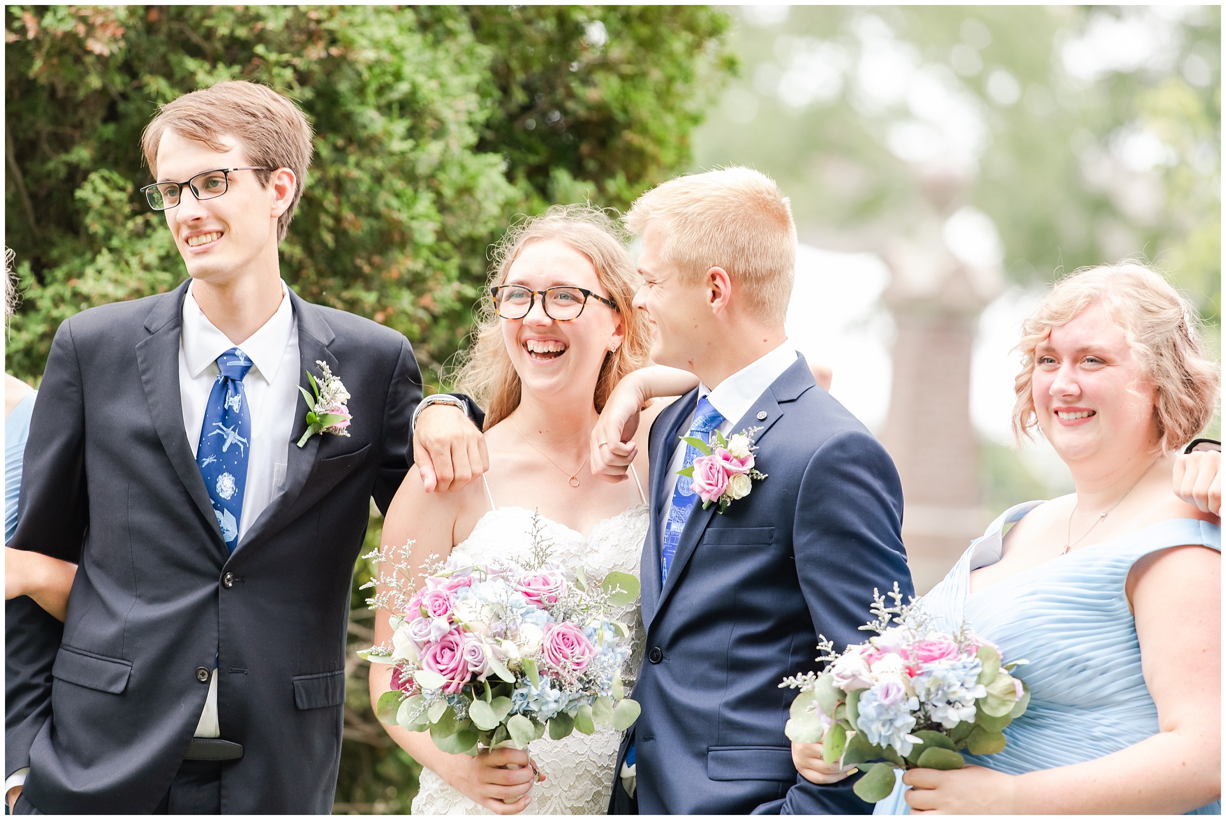 a bride, groom, maid of honour and best man, all laugh together by kitchener wedding photographer life is beautiful photography