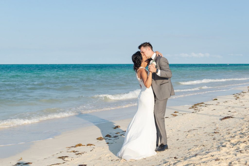 a couple kisses on the beach in cayo coco cuba