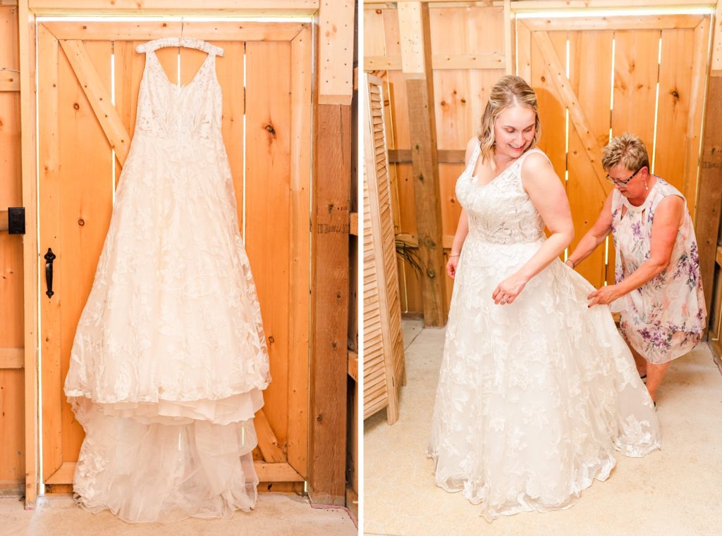 a mother helps a bride into her wedding dress